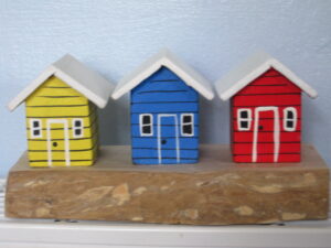 Three Beach Huts on a Block