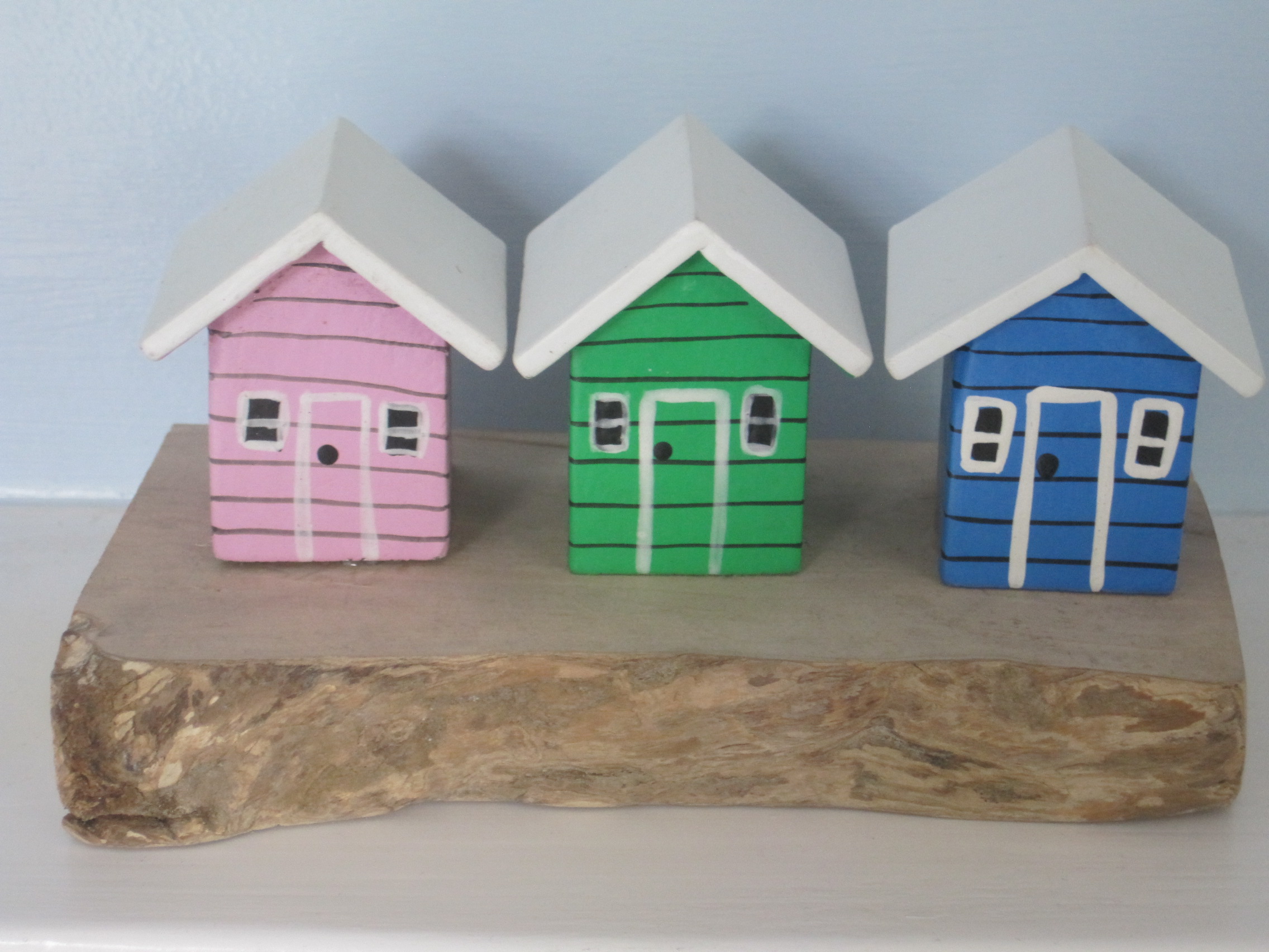 Three Beach Huts on a Block